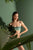 Top strapless con bloques de color verde en lurex