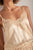 Pijama enterito escote cruzado en encaje Color Marfil
